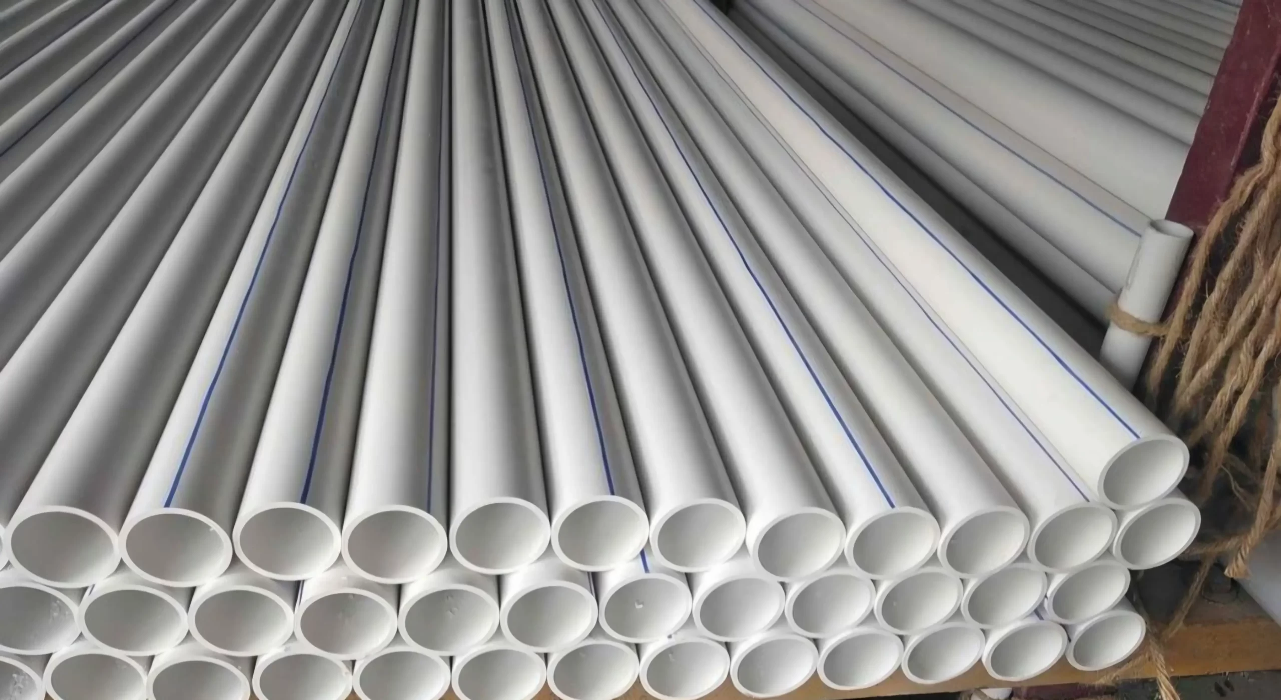 White PVC pipes with blue ID stripe
